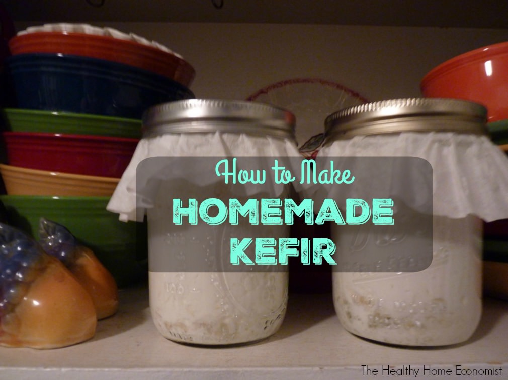 homemade kefir in glass jars on kitchen shelf