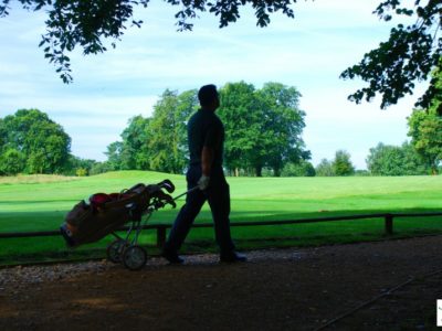 man playing golf on a pesticide ridden course