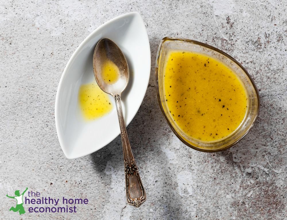 maple mustard salad dressing in small glass bowl with spoon