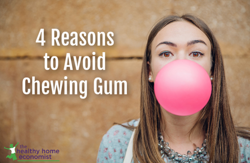 young woman blowing a bubble with chewing gum