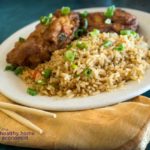 healthy egg foo yung on white plate with chopsticks