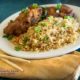 healthy egg foo yung on white plate with chopsticks