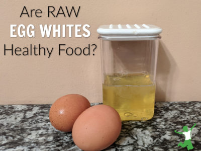 raw eggs whites in a clear container on a granite table