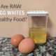 raw eggs whites in a clear container on a granite table