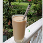 coconut milk smoothie in a glass with straw