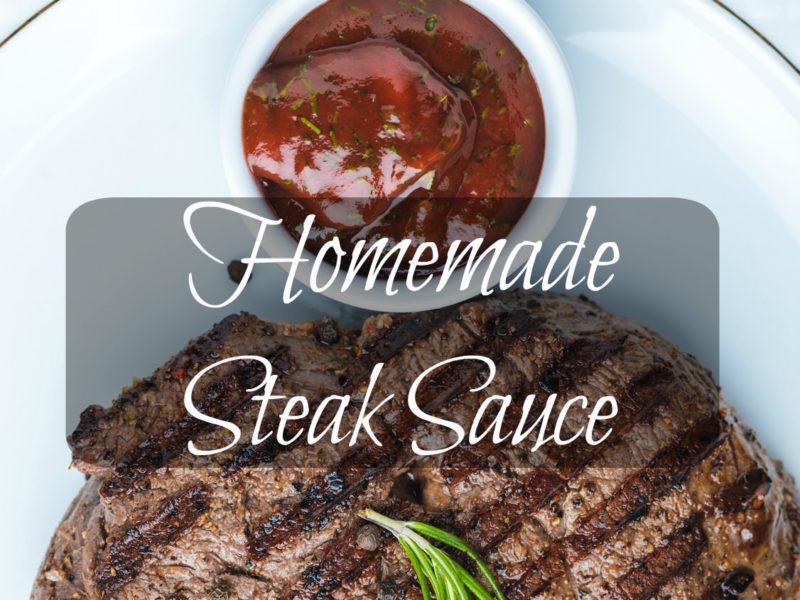 homemade steak sauce next to a grilled steak on a platter