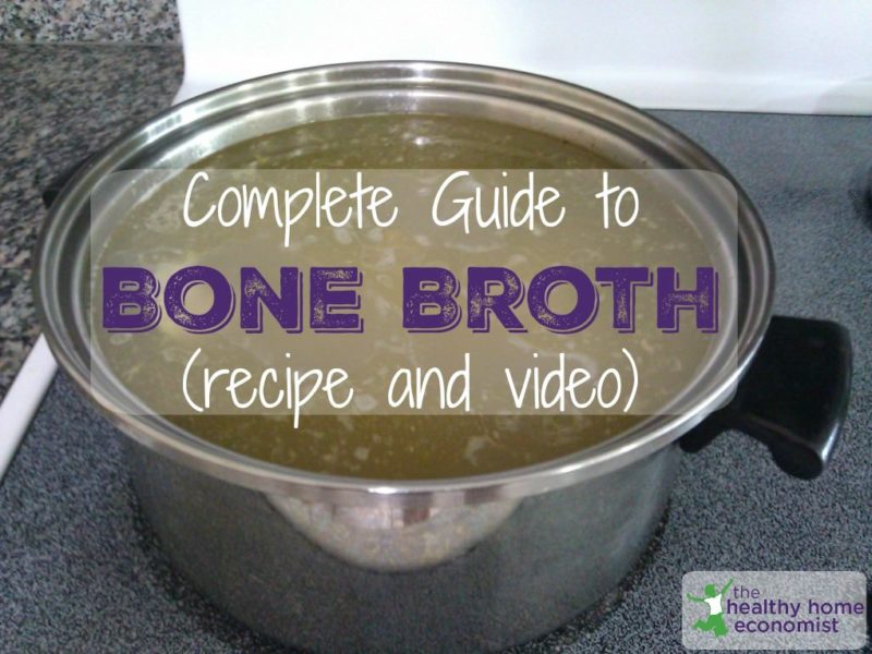 homemade chicken bone broth in a large stockpot on the stove