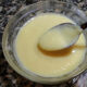 homemade vanilla pudding in glass bowl with spoon