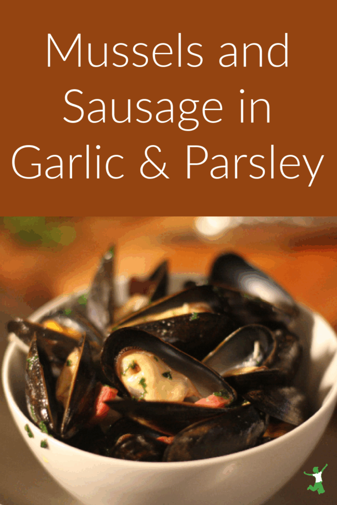 mussels and sausage sauted in garlic and butter in bowl