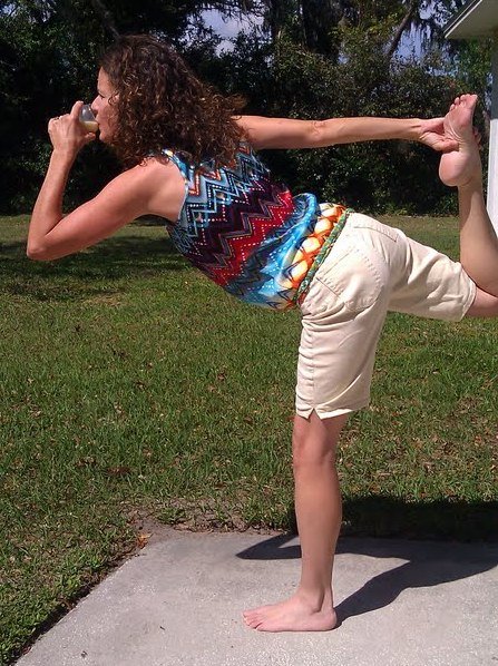 woman doing yoga and drinking raw milk