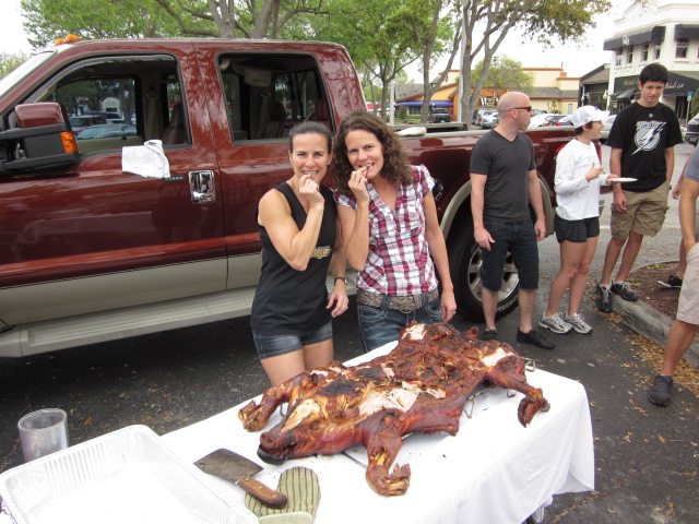 two women enjoying boss hog on a table
