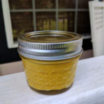 homemade fermented yellow mustard on porch rail