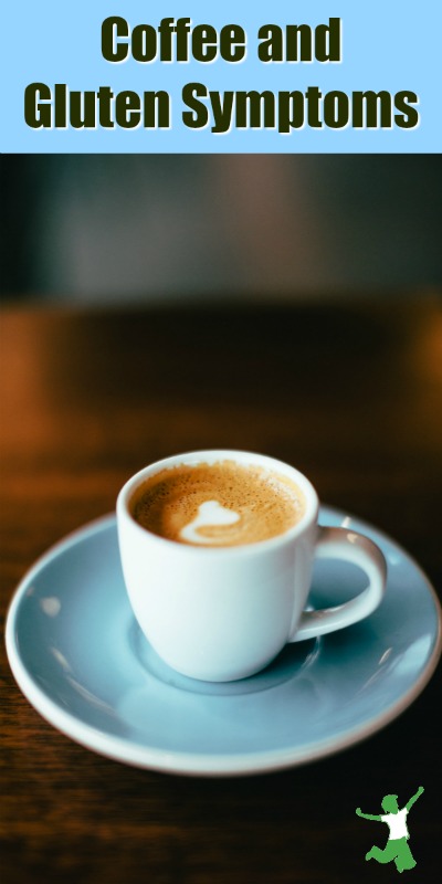 espresso cup with foam on a dish on a dark wood table