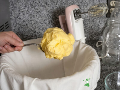 fresh raw butter on a large serving spoon