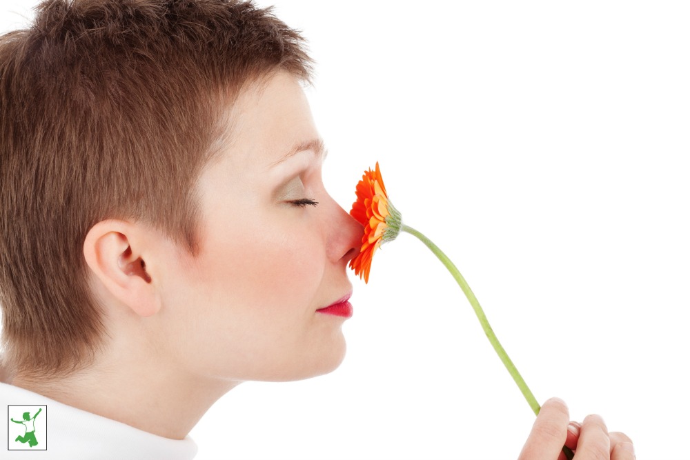 consumer smelling a flower