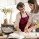 Woman and grandmother preparing a heritage-accurate traditional meal