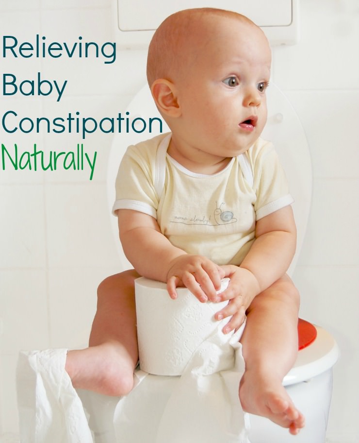 constipated baby sitting on the potty holding a roll of toilet paper