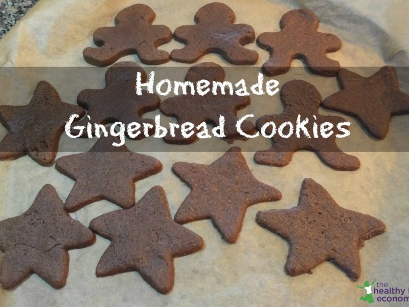 molasses gingerbread cookies cut into shapes on parchment paper