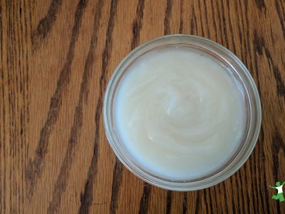 healthy sweetened condensed milk in glass bowl on wooden table