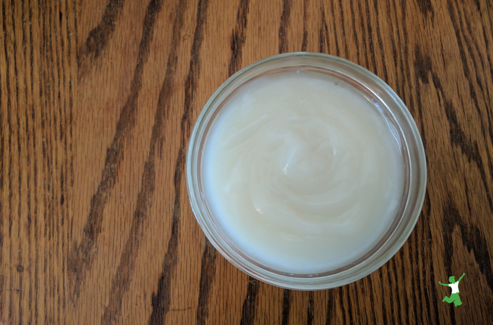 healthy sweetened condensed milk in glass bowl on wooden table