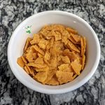 healthy corn flakes in a white bowl