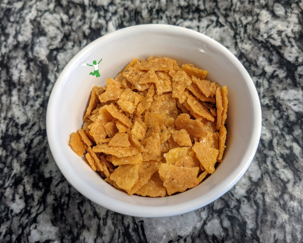 homemade, healthy corn flakes in a white bowl