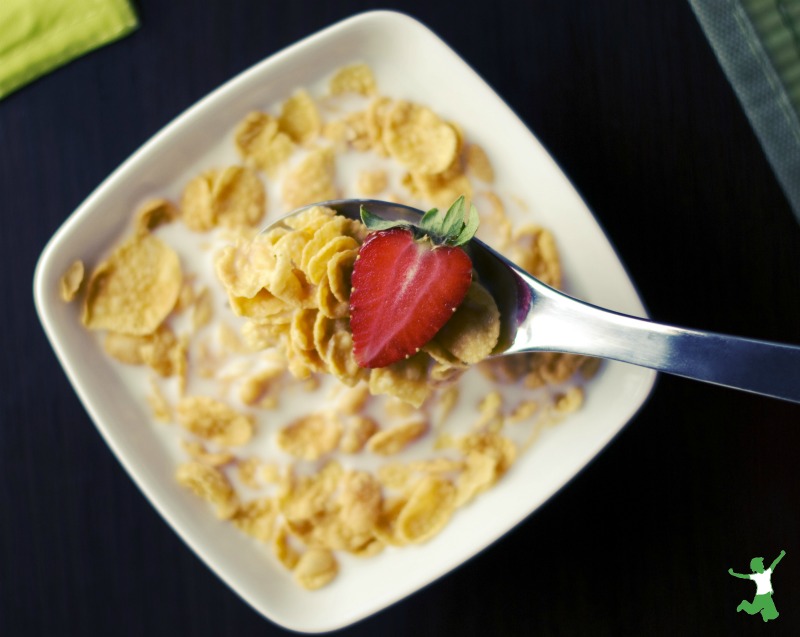 corn flakes cereal in a bowl with strawberry