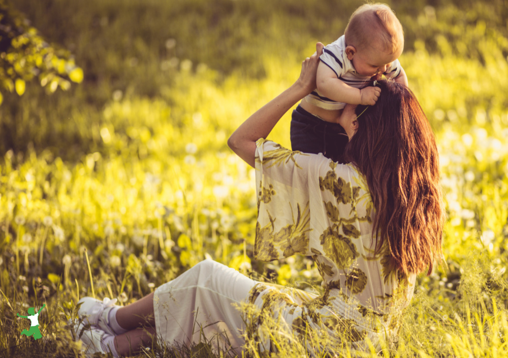 woman who did best exercise for natural birth holding her healthy baby