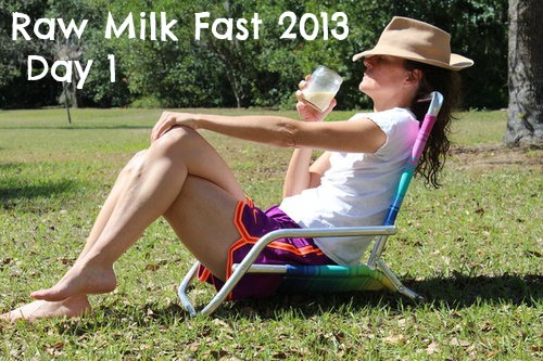 fasting woman in a chair outside with a glass of raw milk