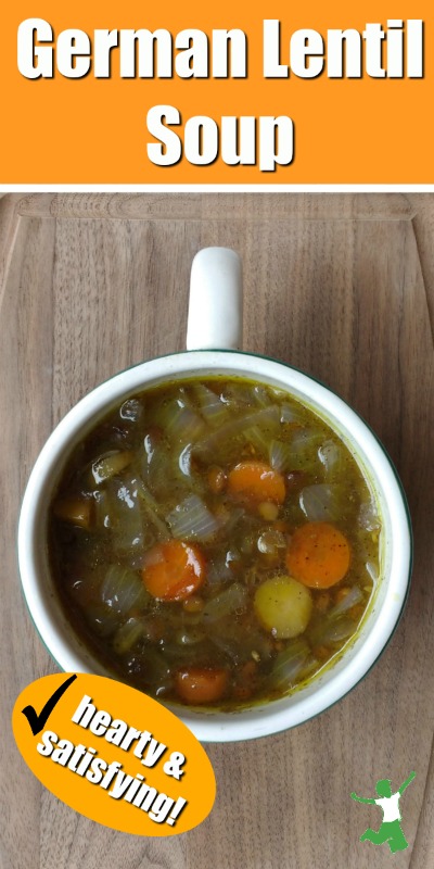 cup on lentil soup on a cutting board