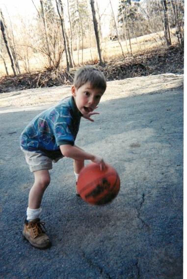 boy playing basketball