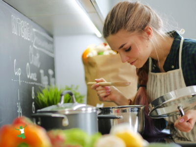 woman cooking Italian vegetable soup with miso base