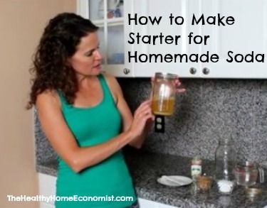 woman holding jar of ginger bug soda starter