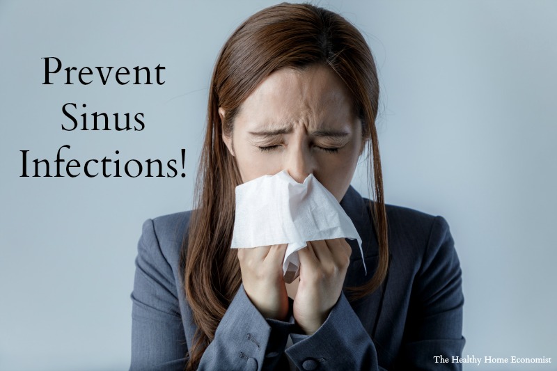 woman trying to prevent sinus congestion blowing her nose