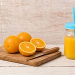 homemade orangina in a mason jar with straw