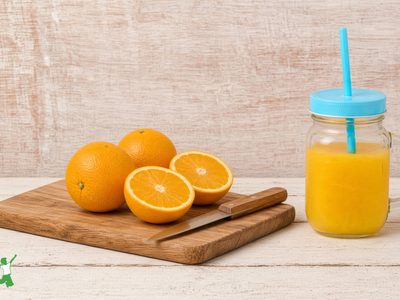 homemade orangina in a mason jar with straw