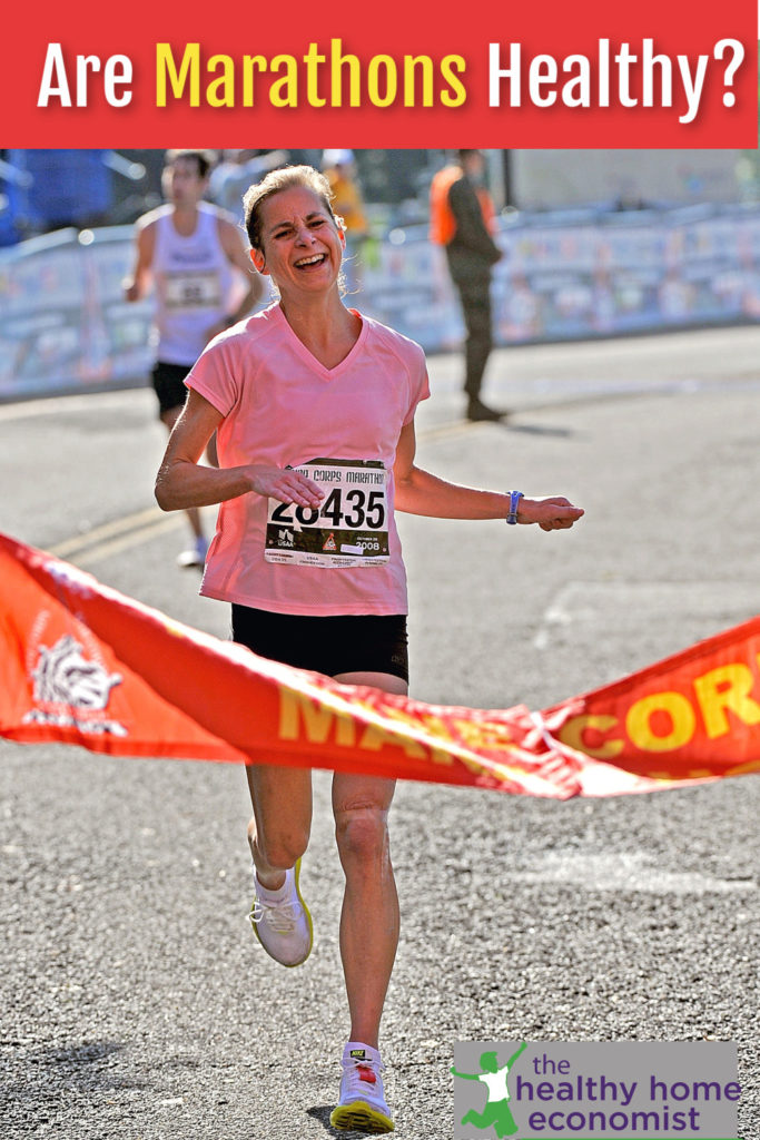 mother nearing the finish of a half marathon