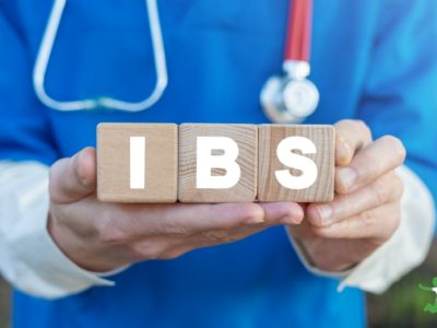 doctor holding the letters IBS