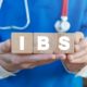 doctor holding the letters IBS