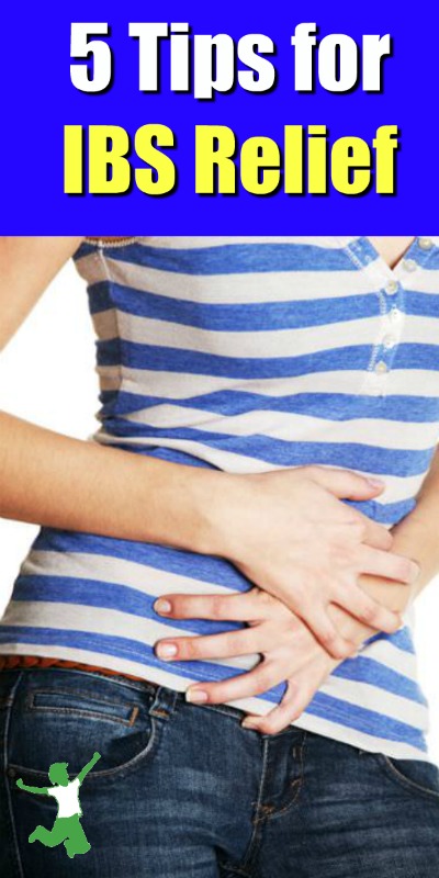 woman with IBS pain holding her abdomen
