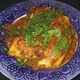 grain-free enchilada on decorative blue plate
