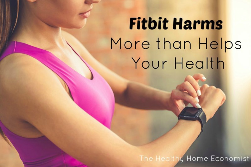 woman checking a fitbit on her wrist