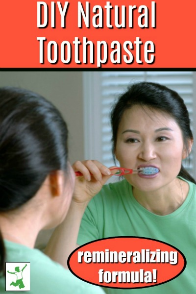 woman brushing with homemade remineralizing toothpaste