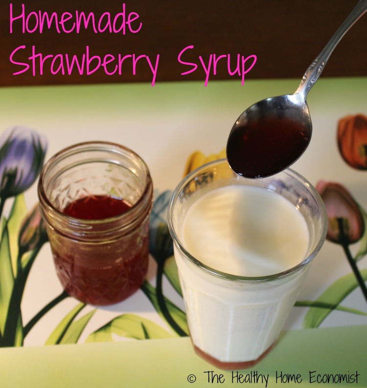 homemade strawberry syrup with a glass of milk