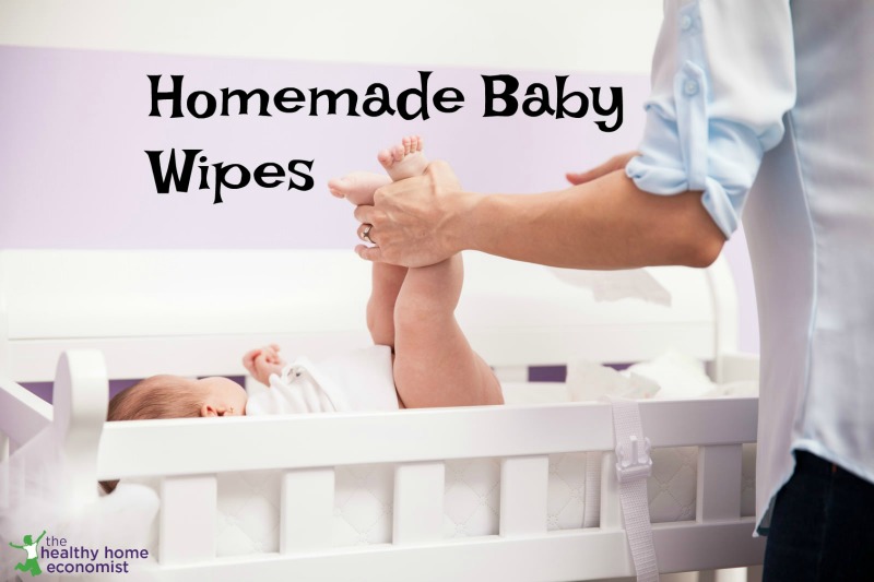 Mom cleaning baby with safe, homemade organic wipes