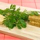 homemade bouillon cubes with lovage leaves on cutting board