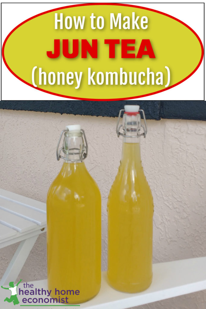 glass bottles of homemade Jun tea on a table