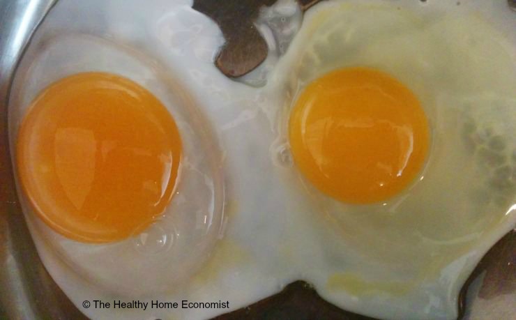 duck egg and chicken egg cooking in pan