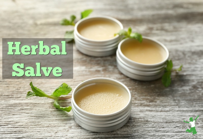 containers of herbal salve on a table