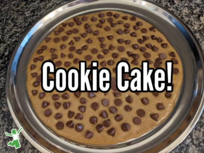chocolate chip cookie cake batter on a pizza pan